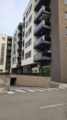 an empty parking lot in front of a building at Apartment Kesten Banja Luka in Banja Luka