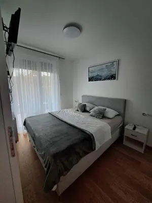 a bedroom with a large bed in a room at Apartment Kesten Banja Luka in Banja Luka