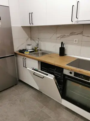a kitchen with white cabinets and a sink at Apartment Kesten Banja Luka in Banja Luka