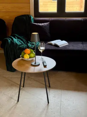 a table with a bowl of fruit and a glass of wine at Test Property in Bosanska Gradiška