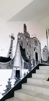 a mural of a building on a wall with stairs at City Hostel Banja Luka in Banja Luka