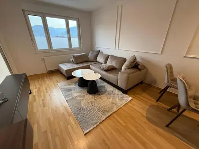 a living room with a couch and a table at Apartman sa dvije sobe in Banja Luka