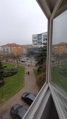 a view from a window of cars parked on a street at Stan na dan in Visoko
