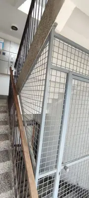 a metal gate on a staircase in a building at Stan na dan in Visoko