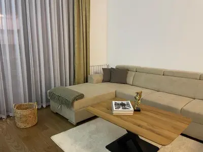 a living room with a couch and a coffee table at Apartman KK VII in Banja Luka