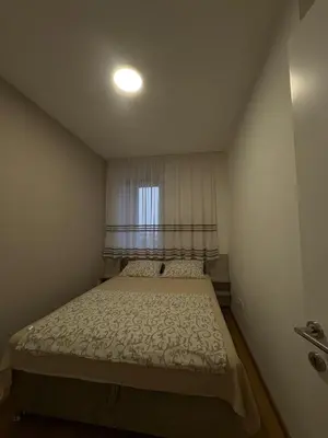 a small bedroom with a bed and a window at Apartment Lofty Dreams in Banja Luka