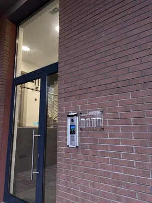 a pay meter on the side of a brick building at Apartment Lofty Dreams in Banja Luka