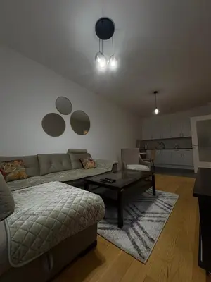 a living room with a couch and a coffee table at Apartment Lofty Dreams in Banja Luka
