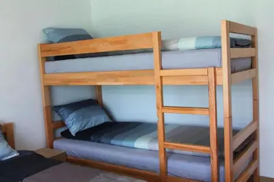 a couple of bunk beds in a room at Hostel Sobe Popović in Nova Bila