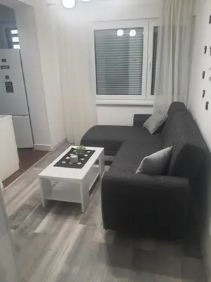 a living room with a couch and a coffee table at Apartman Bato in Banja Luka