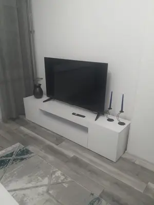 a flat screen tv sitting on a white entertainment center at Apartman Bato in Banja Luka