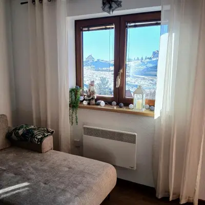 a room with a window with a radiator and a window sill at Apartman Montis in Kupres