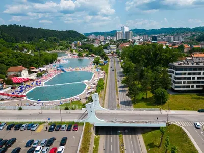 an aerial view of a city with a beach at Dinka Apartments Park Lake in Tuzla