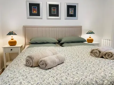 a bedroom with two towels on a bed at Dinka Apartments Park Lake in Tuzla