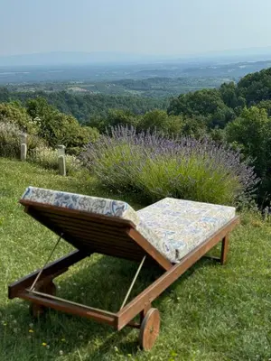 a bed sitting on top of a field of grass at Kozara Panoramic Resort in Bosanska Gradiška