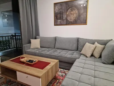 a living room with a couch and a coffee table at Apartman Miki in Vlasic