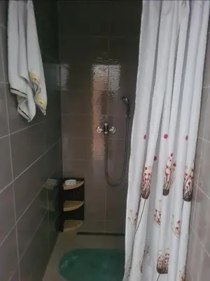 a bathroom with a shower with a shower curtain at Prenoćište Durić in Cazin
