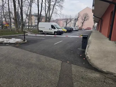 a white van parked on the side of a street at Apartman IVA in Modriča