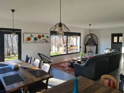 a living room with a table and a couch at Villa Aria in Bosanska Krupa