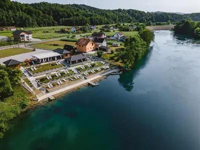 an aerial view of a house next to a river at Una Relax in Vajagići
