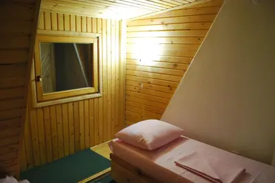 a small room with a bench and a window at Apartments A Vlasic in Vlasic