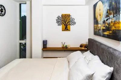 a bedroom with a bed and a picture on the wall at SkyLux Vlašić in Šišava