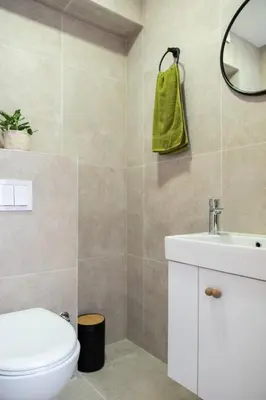 a bathroom with a white toilet and a sink at Viva Vlasic - Apartman i vikendica in Šišava
