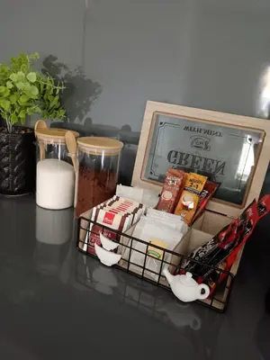 a table with a box of food on a table at SPA APARTMAN Prijedor in Prijedor
