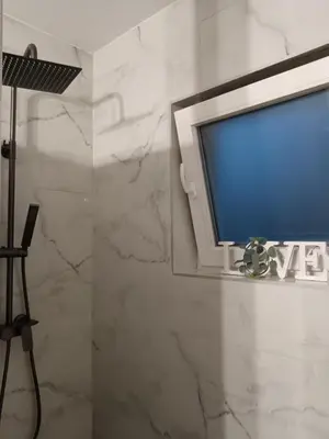 a flat screen tv sitting on a wall at SPA APARTMAN Prijedor in Prijedor