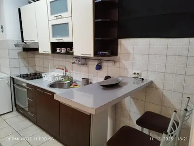 a small kitchen with a sink and a counter at Gold Mejdan in Banja Luka