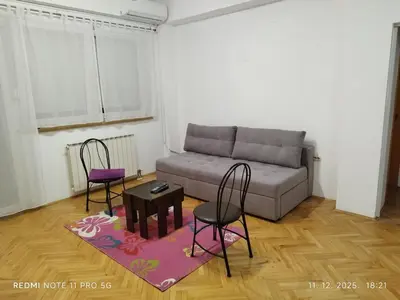 a living room with a couch and two chairs at Gold Mejdan in Banja Luka