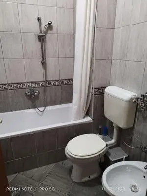a bathroom with a toilet and a shower and a sink at Gold Mejdan in Banja Luka