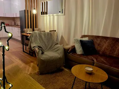 a living room with a couch and a table at Novicasa in Železnička Stanica Incel