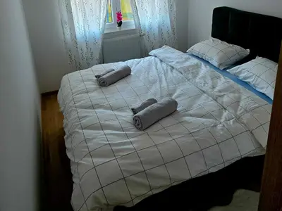 a bed with two pillows on top of it at Novicasa in Železnička Stanica Incel