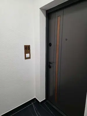 a door in a room with a sign on it at Novicasa in Železnička Stanica Incel