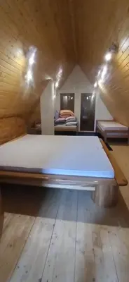 a large bed in a room with two beds at Connect 4 - Vlašić Vikendica in Šišava