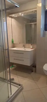 a bathroom with a white sink and a toilet at Connect 4 - Vlašić Vikendica in Šišava