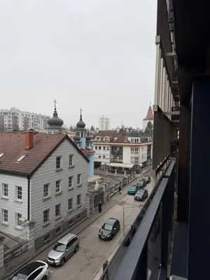 a view of a city street with cars parked at Palata Royal Banja Luka Luxury Apartment in Banja Luka