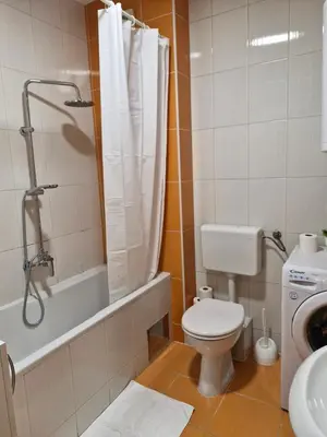 a bathroom with a toilet and a shower and a sink at Pollaris in Banja Luka