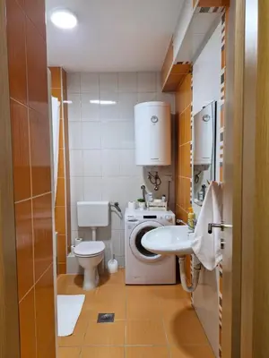 a small bathroom with a toilet and a sink at Pollaris in Banja Luka