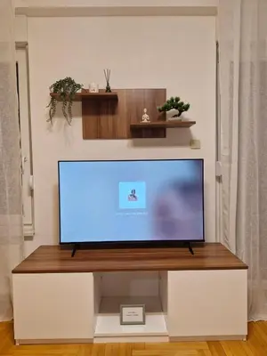 a flat screen tv sitting on a white entertainment center at Pollaris in Banja Luka