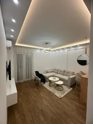 a living room with a couch and a table at Aurelia Apartmani - Banja Luka-Borik in Banja Luka