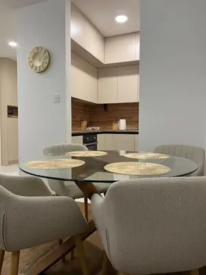a dining room with a glass table and chairs at Aurelia Apartmani - Banja Luka-Borik in Banja Luka