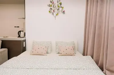 a bedroom with a bed with two pillows at Studio apartman NINA in Livno