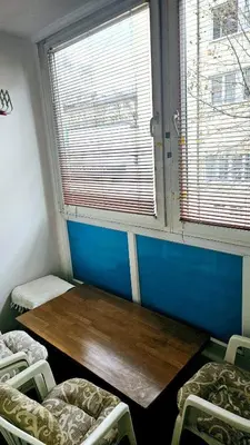 a room with a table and chairs and a window at Stan na dan - Apartman Centar Kakanj in Kakanj