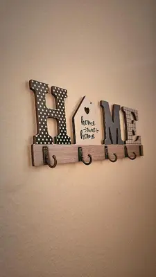 a sign that says love hanging on a wall at Stan na dan - Apartman Centar Kakanj in Kakanj
