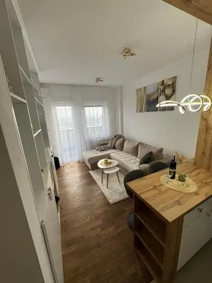 a living room with a couch and a table at Cozy apartment Banja Luka in Budžak