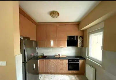 a kitchen with a stainless steel refrigerator and a window at Panorama in Pištelići
