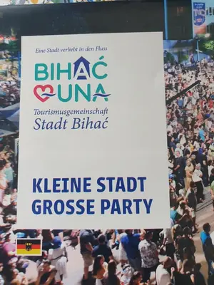 a large crowd of people at a event with a sign at Apartman Una Vista in Ivišovo Greblje