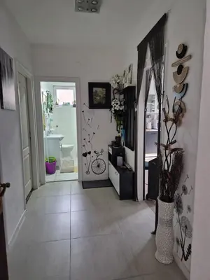 a room with a hallway with a room with a bathroom at Apartman Una Vista in Ivišovo Greblje